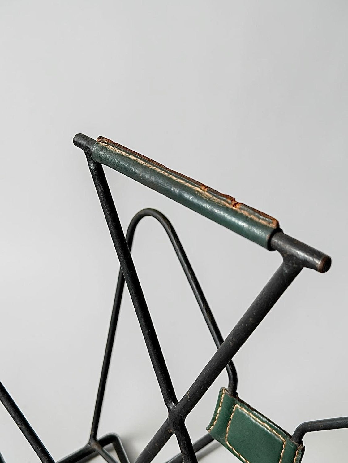 Magazine rack by Jacques Adnet, 1950s