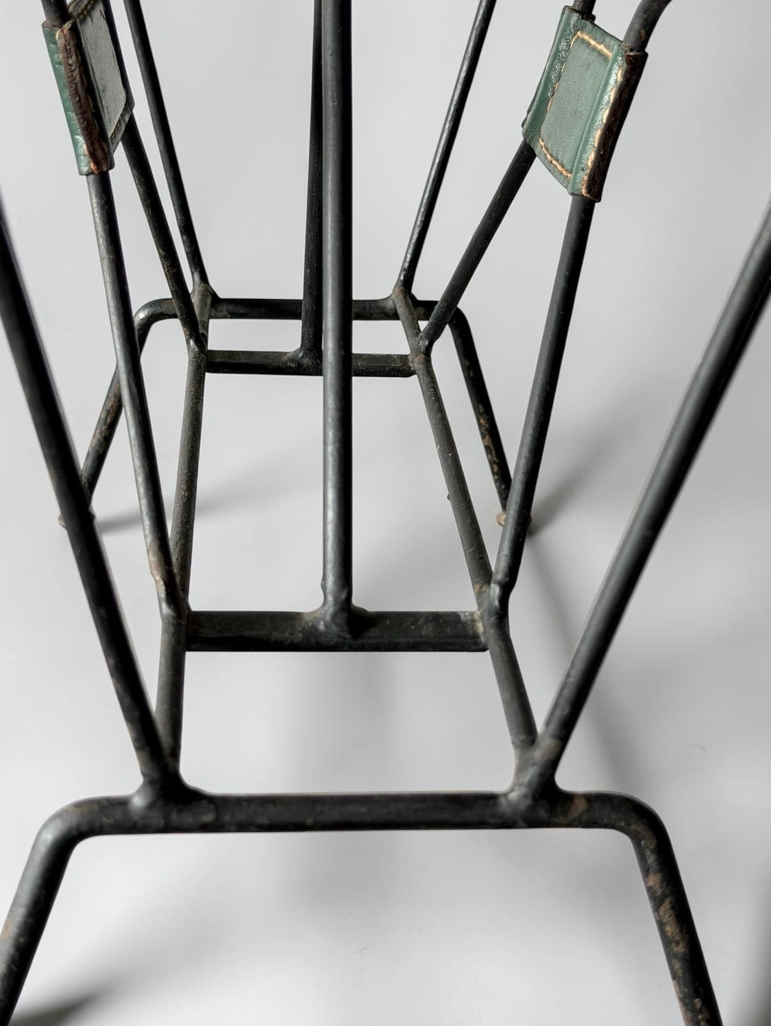 Magazine rack by Jacques Adnet, 1950s
