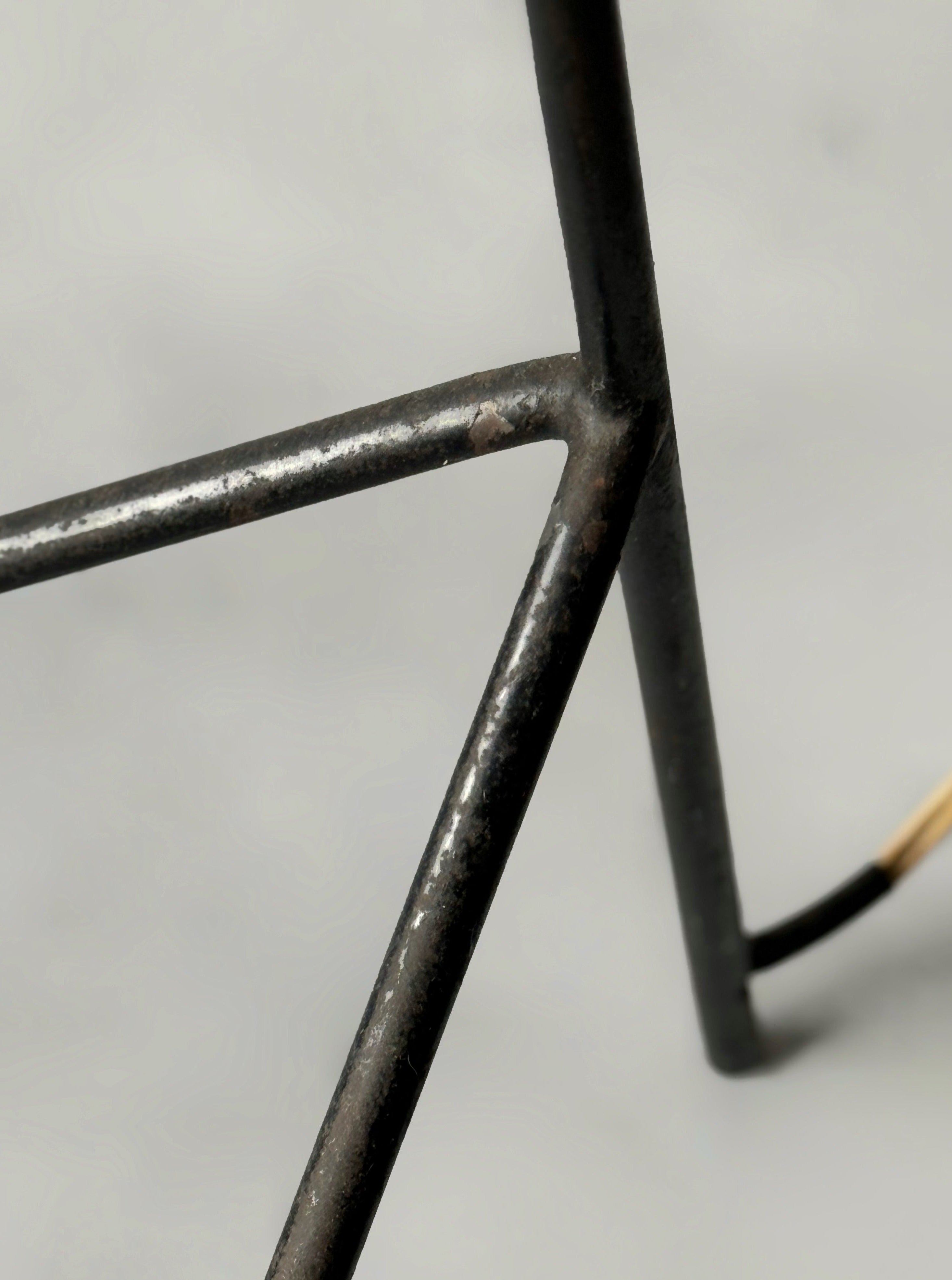 A black lacquered metal floor lamp by Kund Joos-Jensen