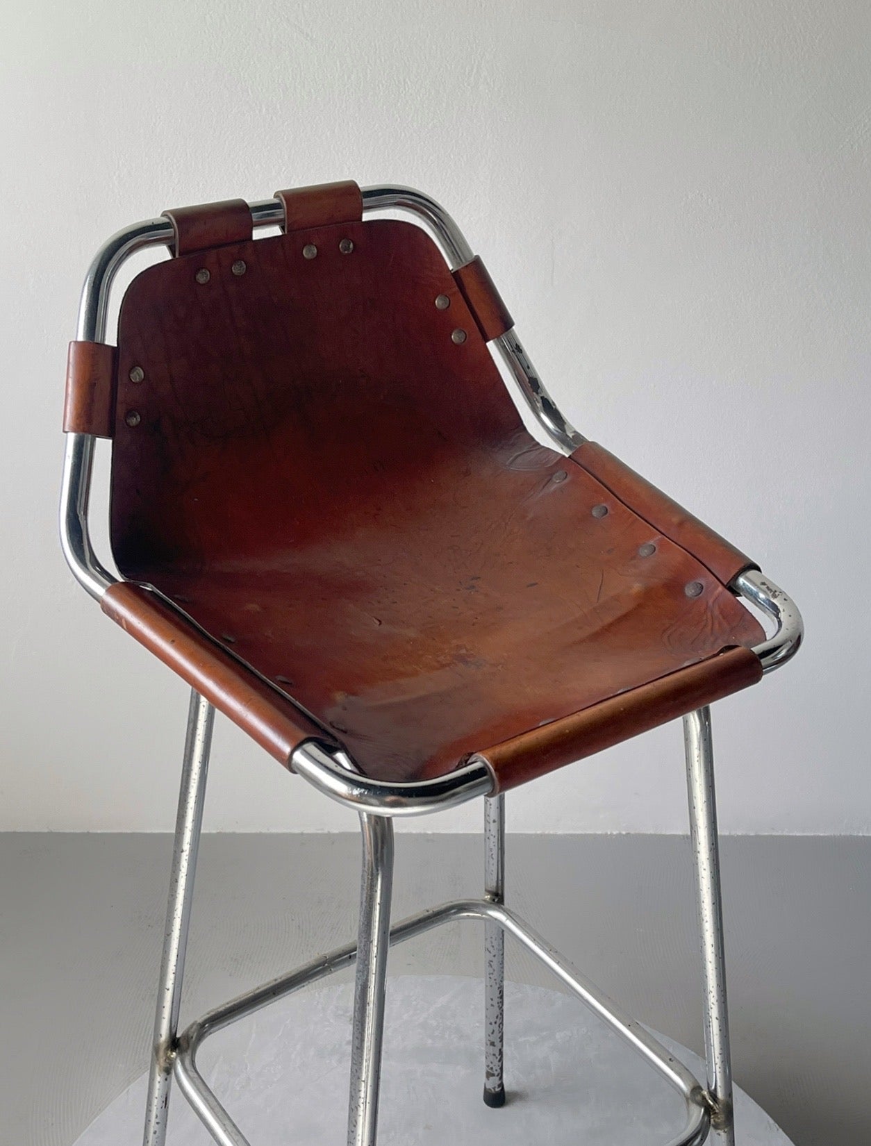 Les Arcs bar stool selected by Charlotte Perriand