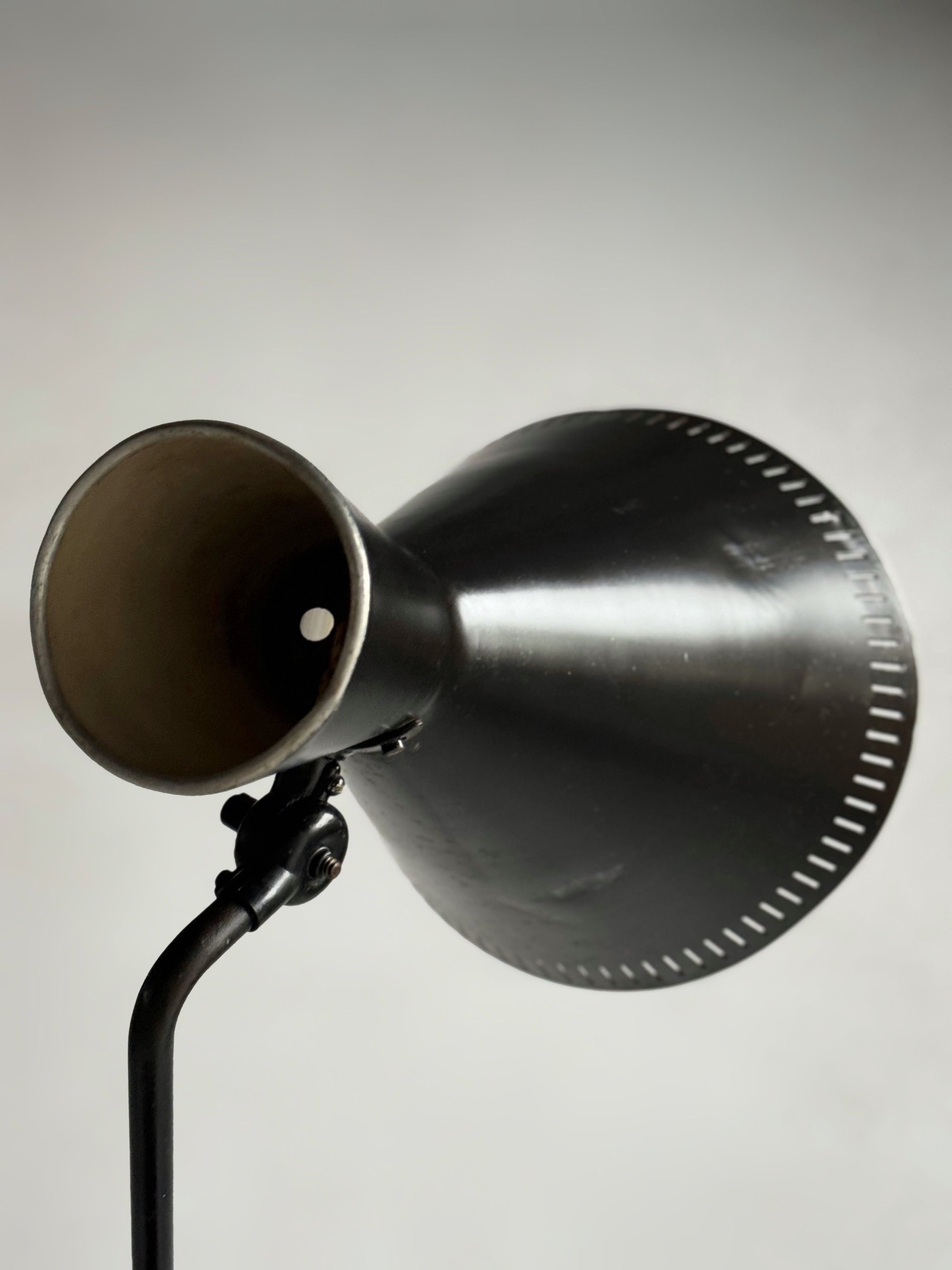 A black lacquered metal floor lamp by Kund Joos-Jensen