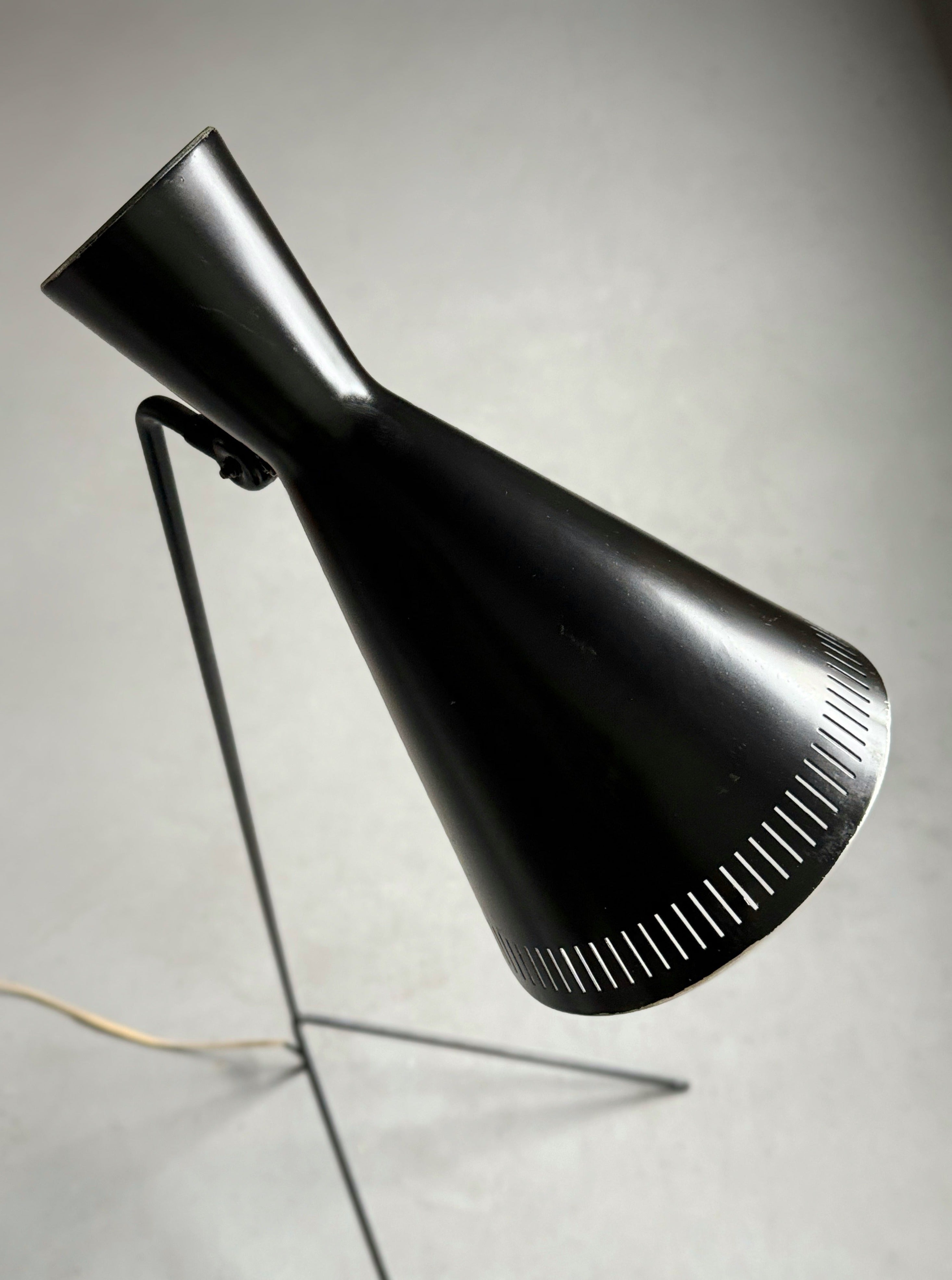 A black lacquered metal floor lamp by Kund Joos-Jensen