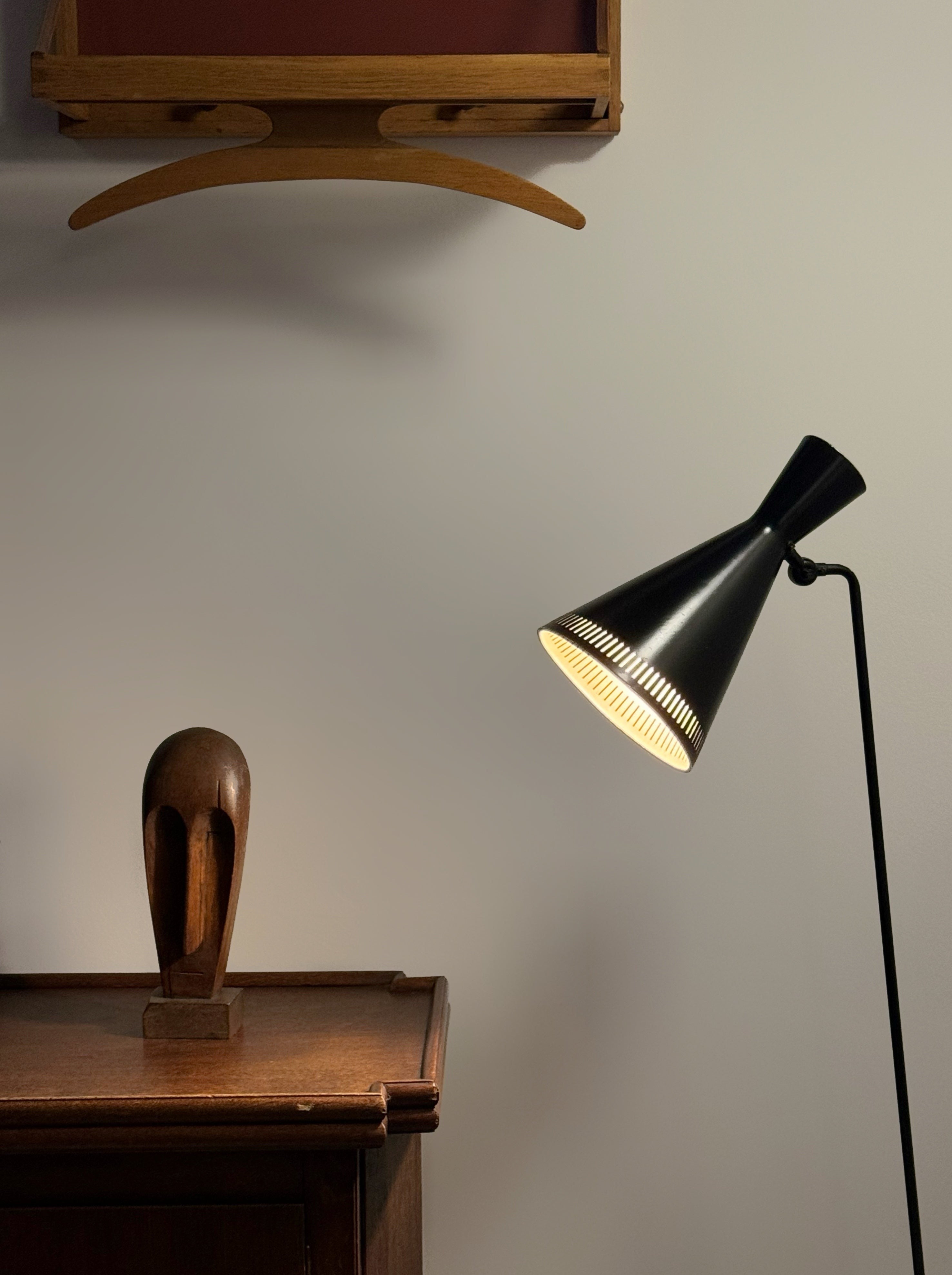 A black lacquered metal floor lamp by Kund Joos-Jensen