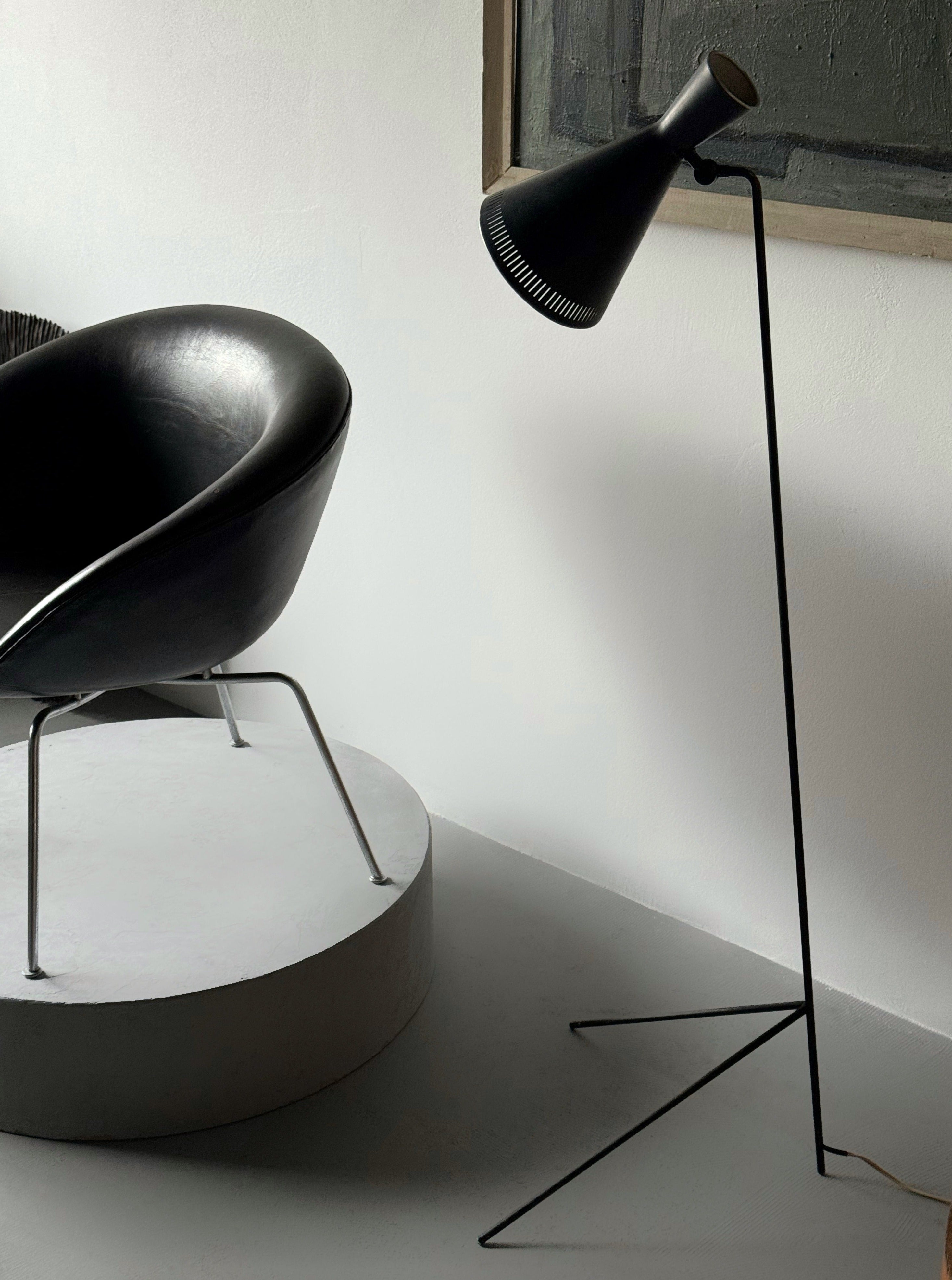 A black lacquered metal floor lamp by Kund Joos-Jensen