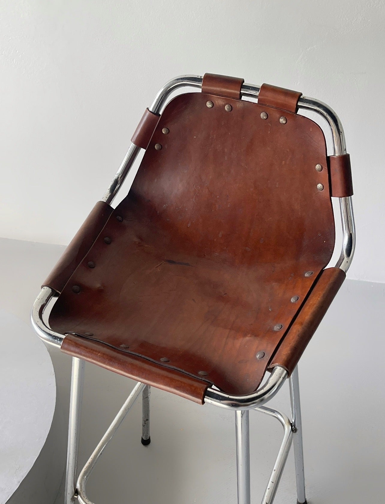 Les Arcs bar stool selected by Charlotte Perriand