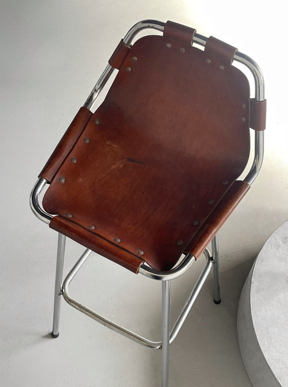 Les Arcs bar stool selected by Charlotte Perriand