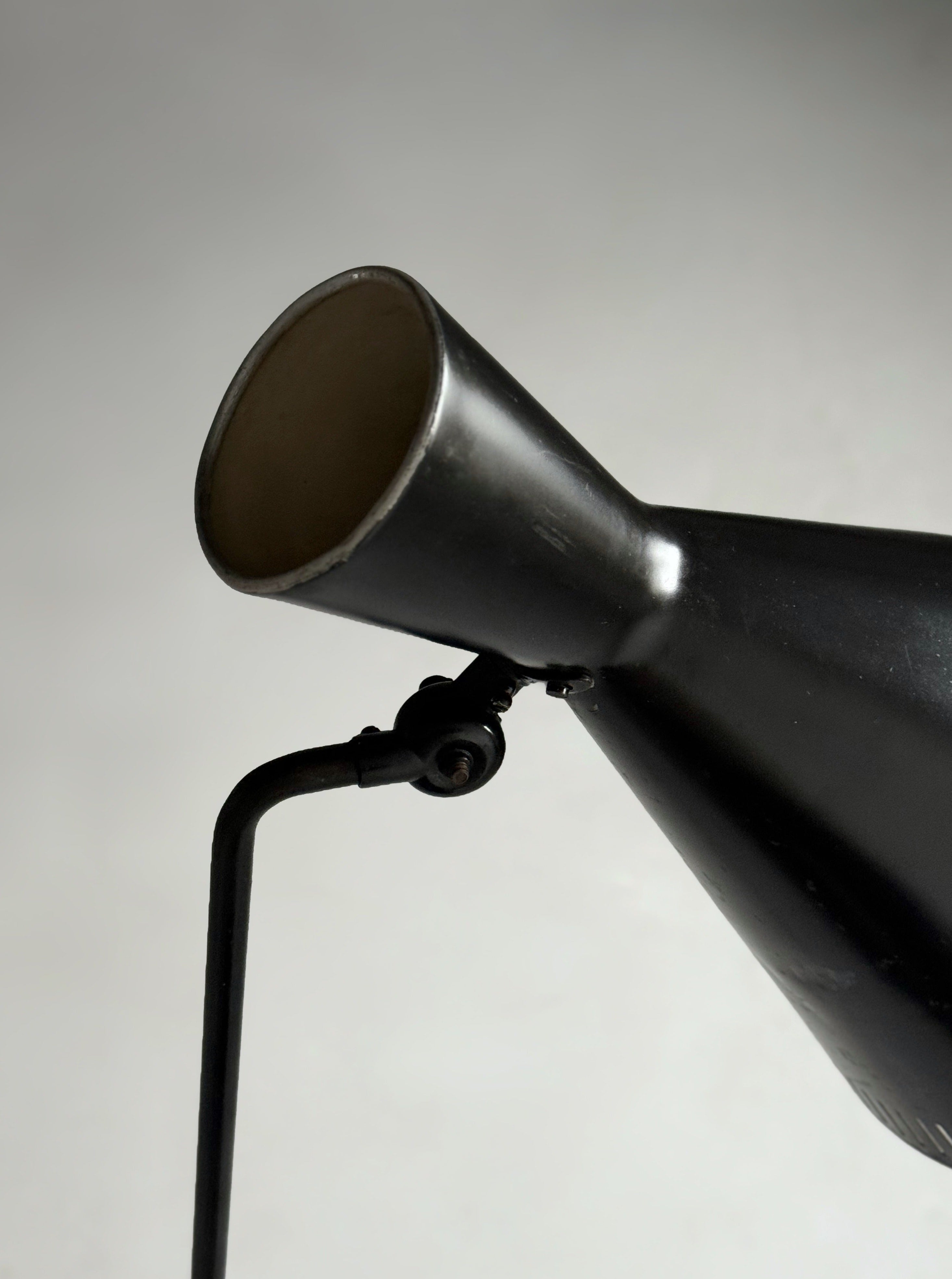 A black lacquered metal floor lamp by Kund Joos-Jensen