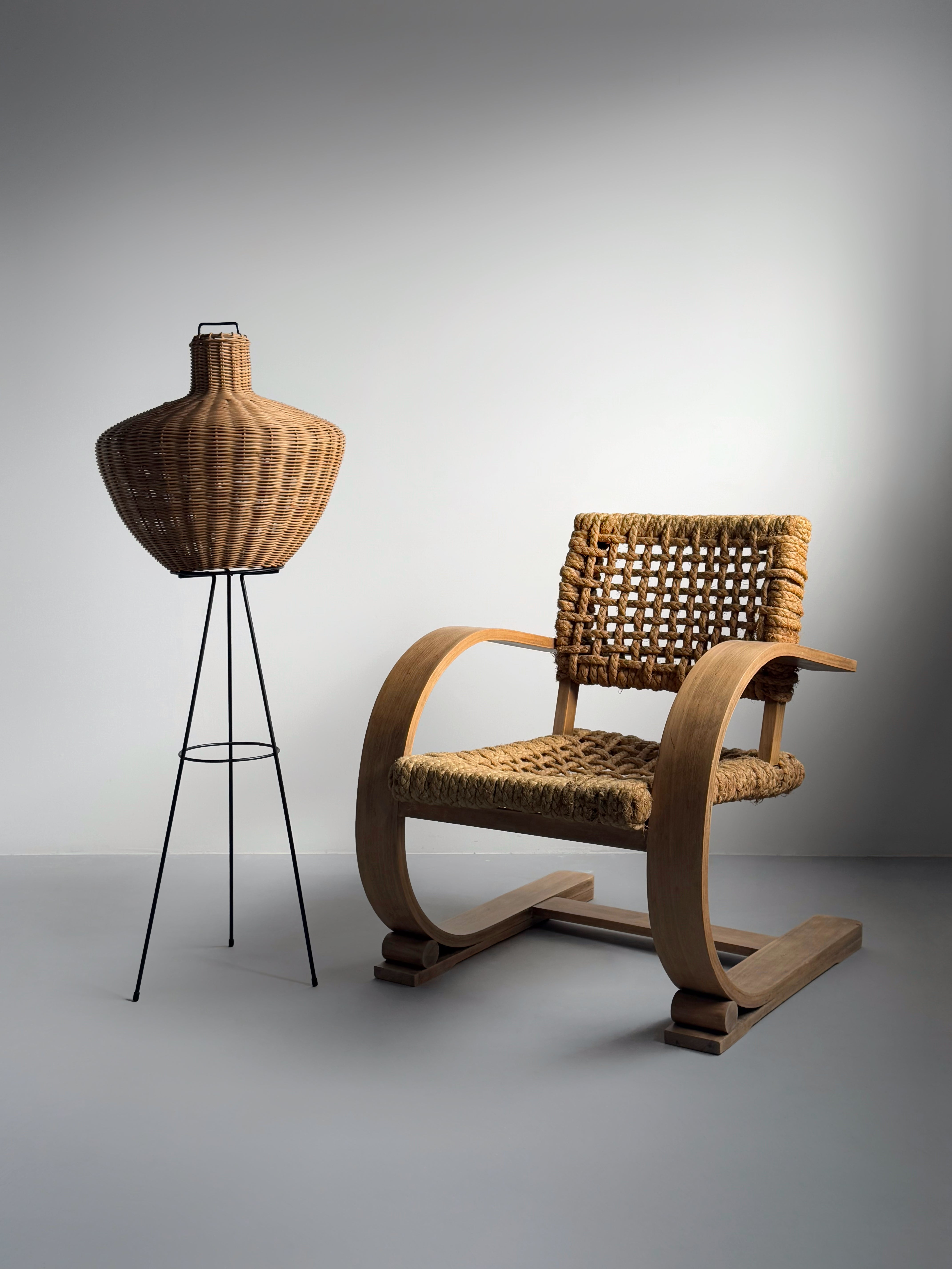 Tripod floor lamp in black metal and rattan 1950s