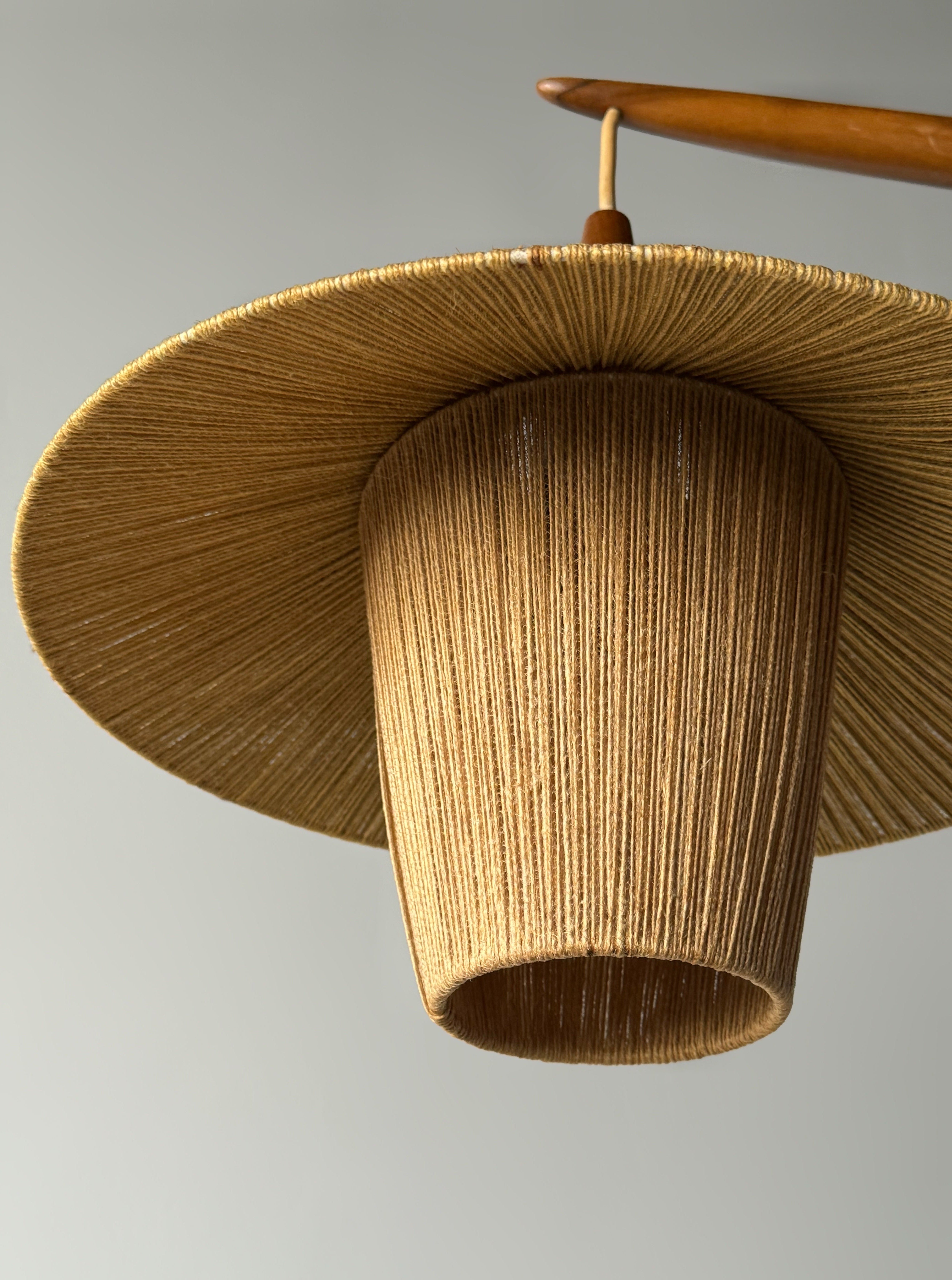 Floor lamp with cord shade manufactured by Temde Leuchten
