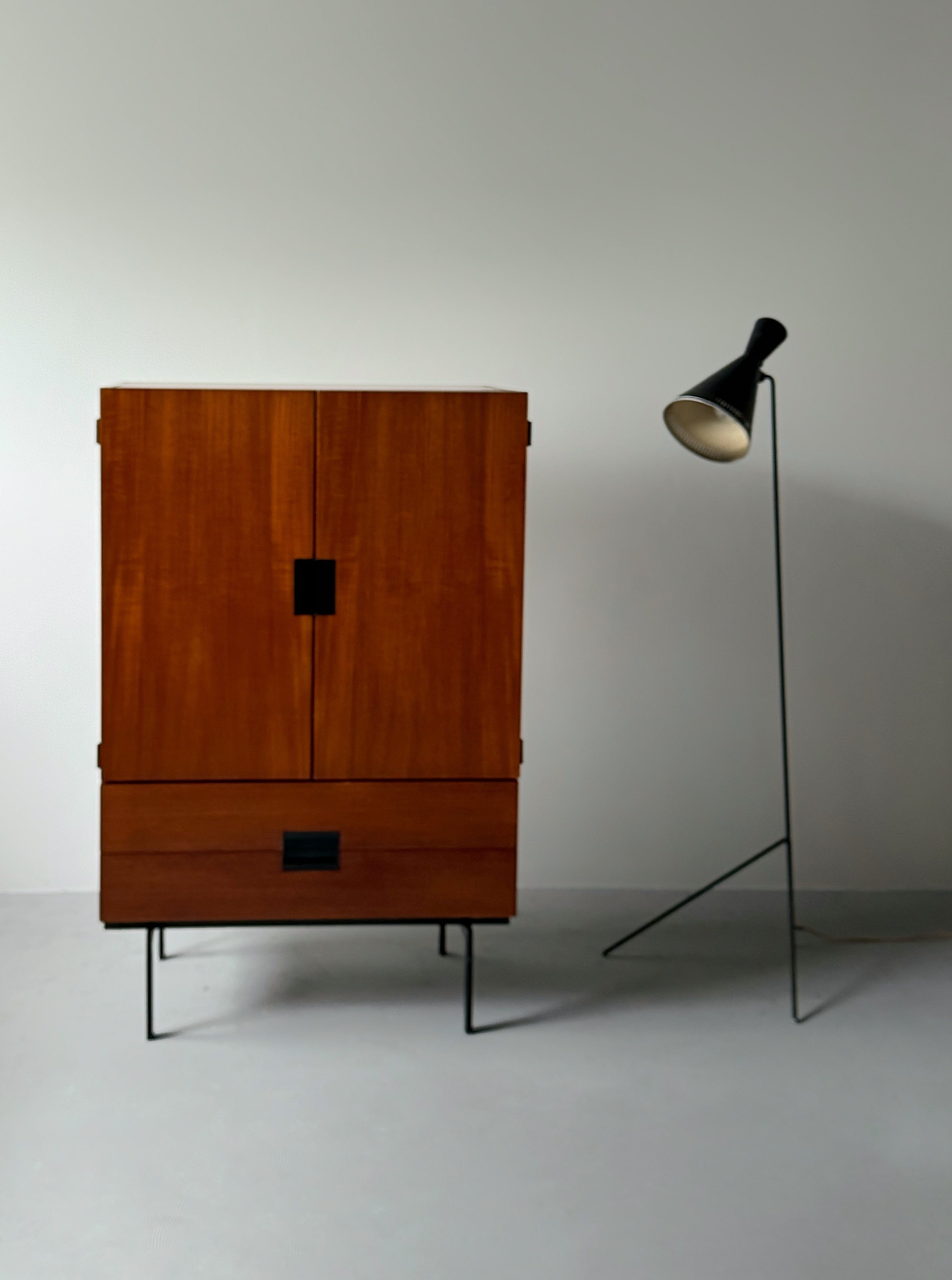 A black lacquered metal floor lamp by Kund Joos-Jensen