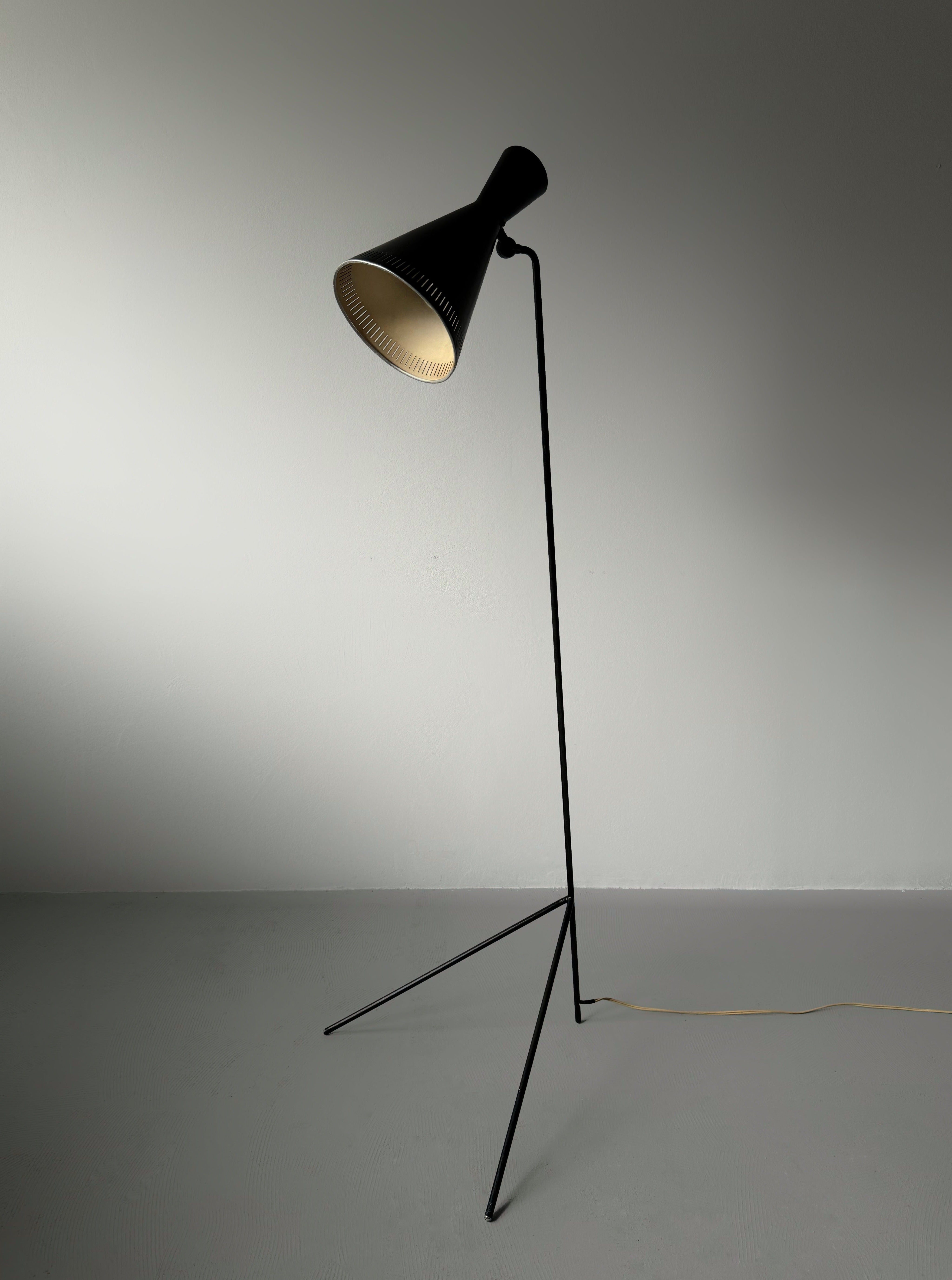 A black lacquered metal floor lamp by Kund Joos-Jensen