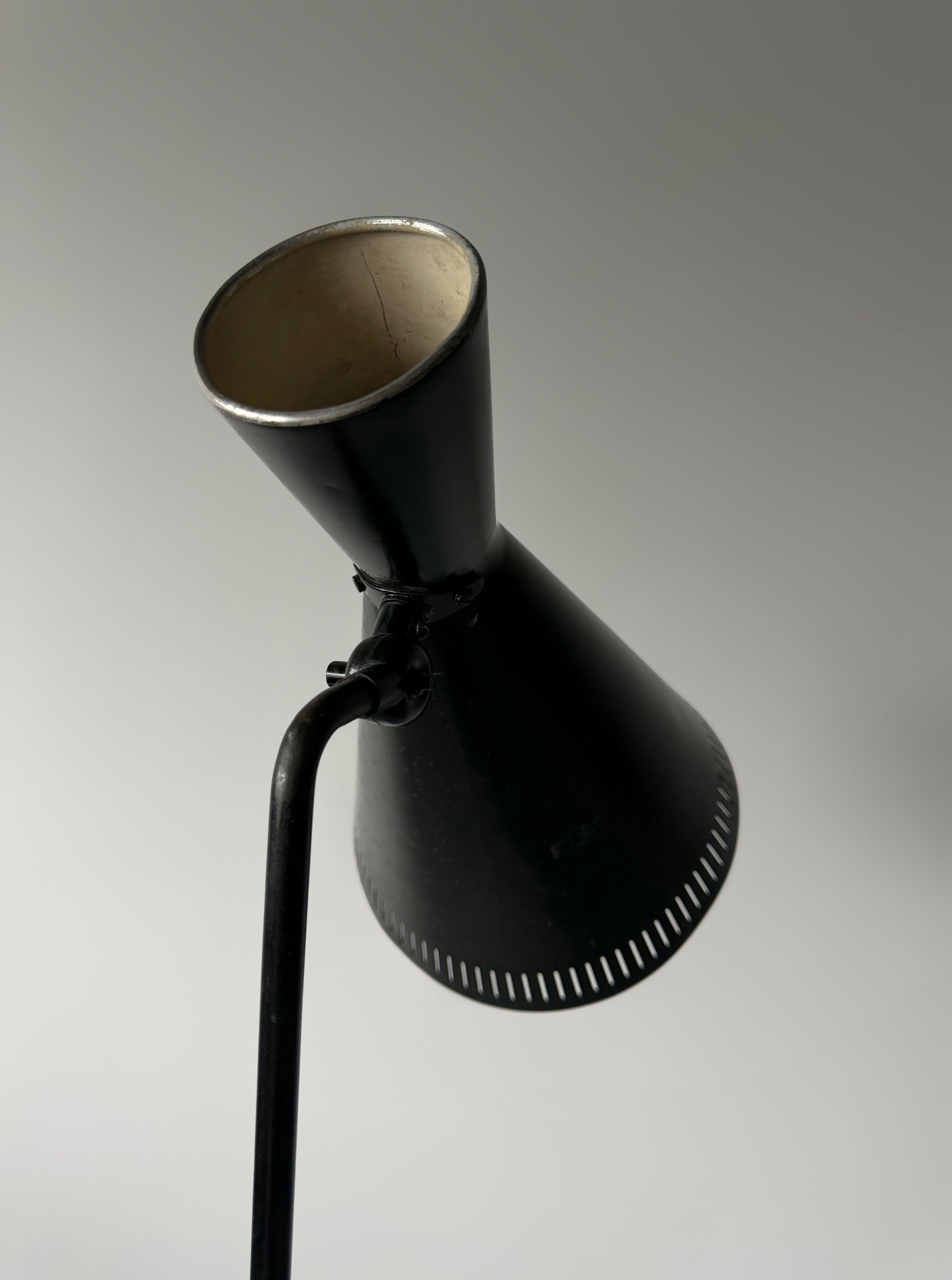 A black lacquered metal floor lamp by Kund Joos-Jensen