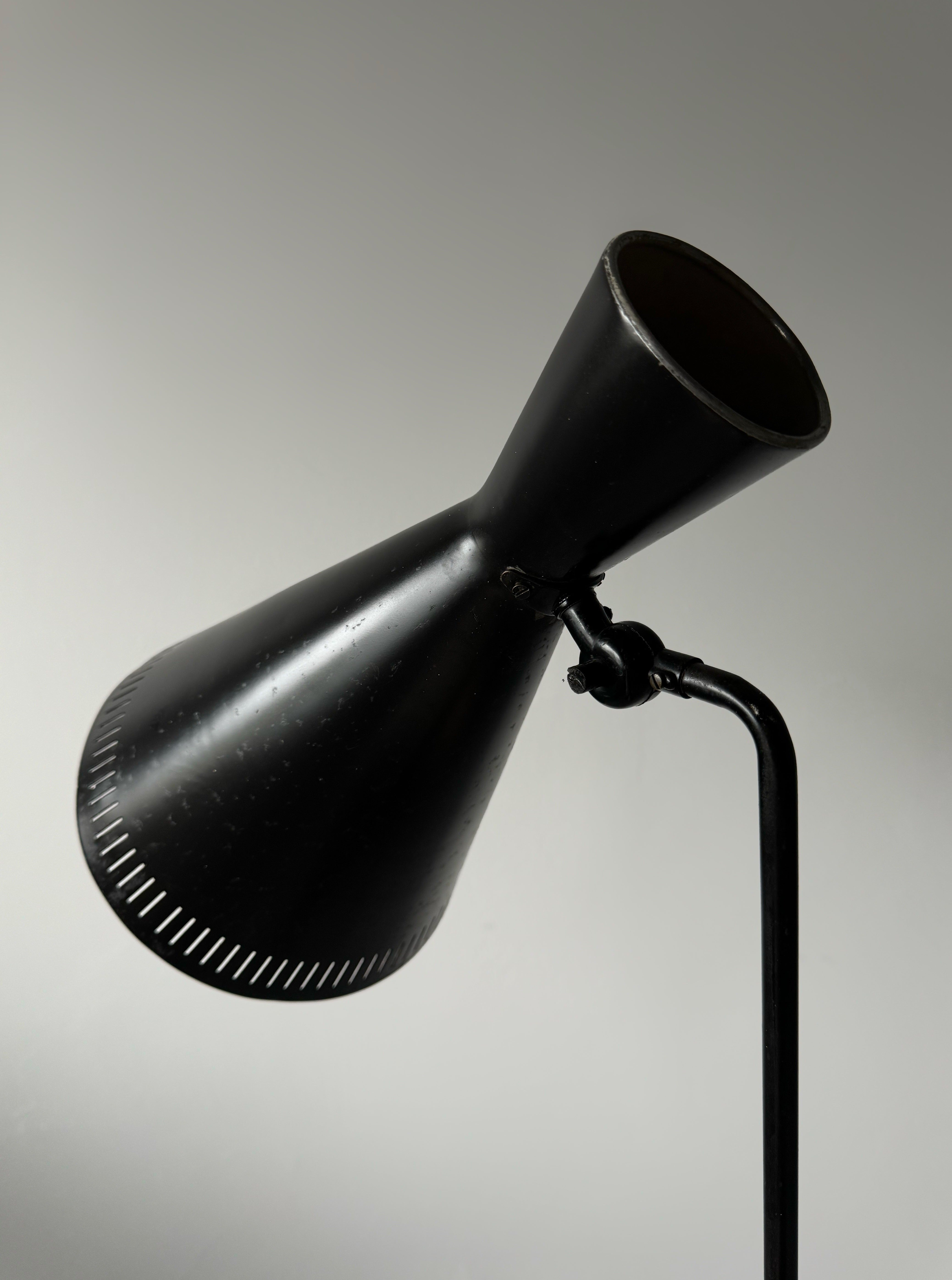 A black lacquered metal floor lamp by Kund Joos-Jensen