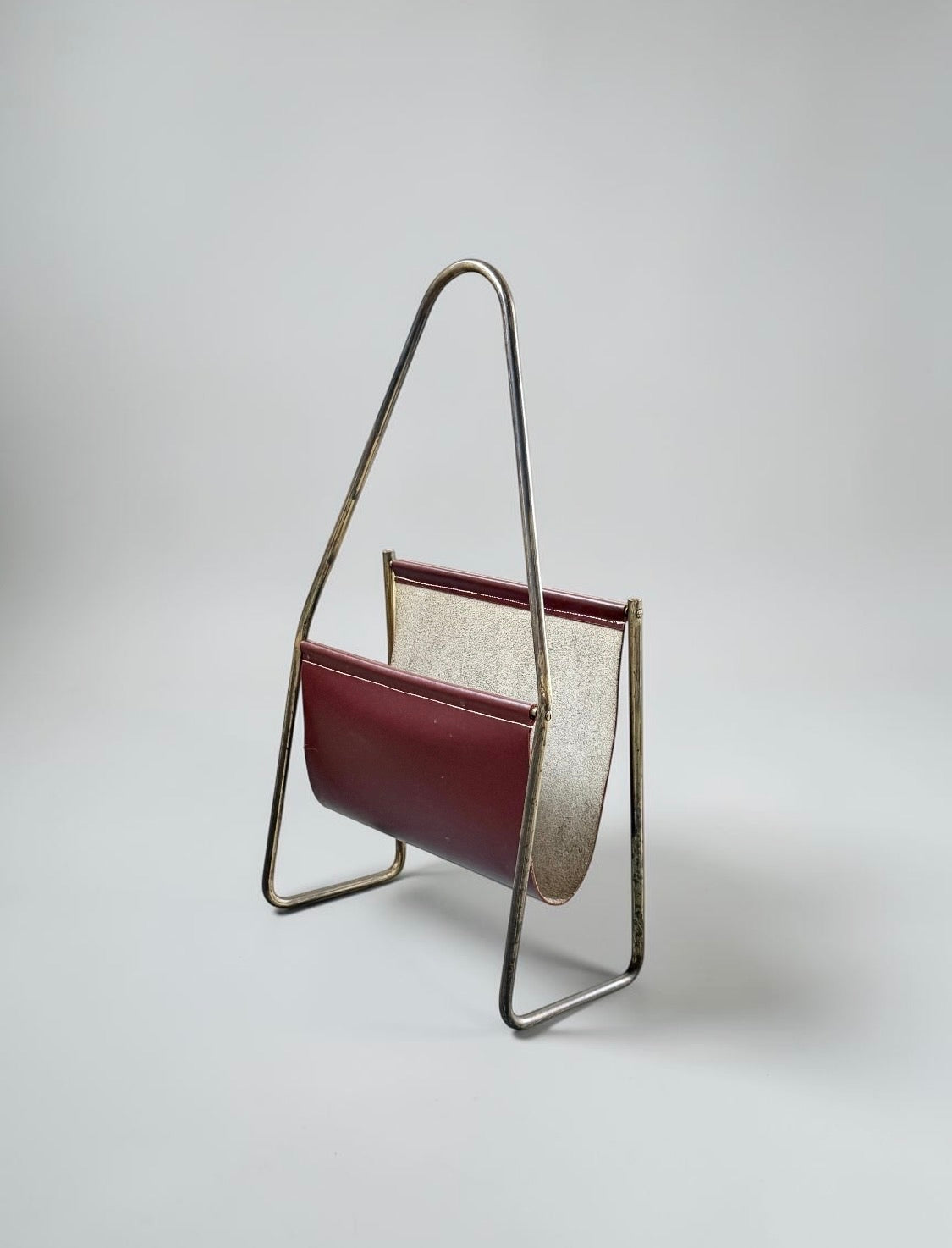 Magazine holder in brass and leather by CARL AUBÖCK (1900-1957) Austria 1950s