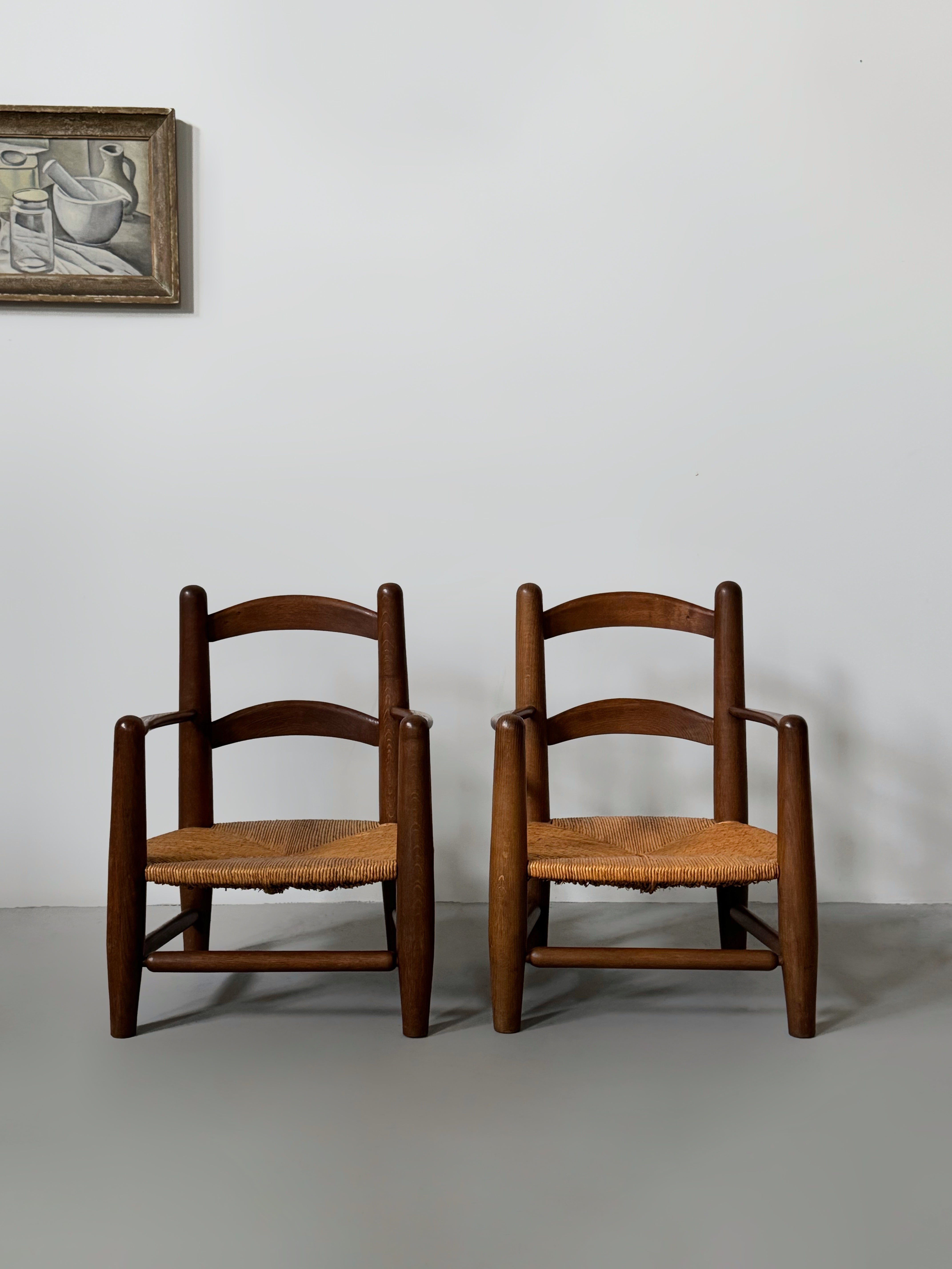 Pair of oak and cane armchairs, France 1950s