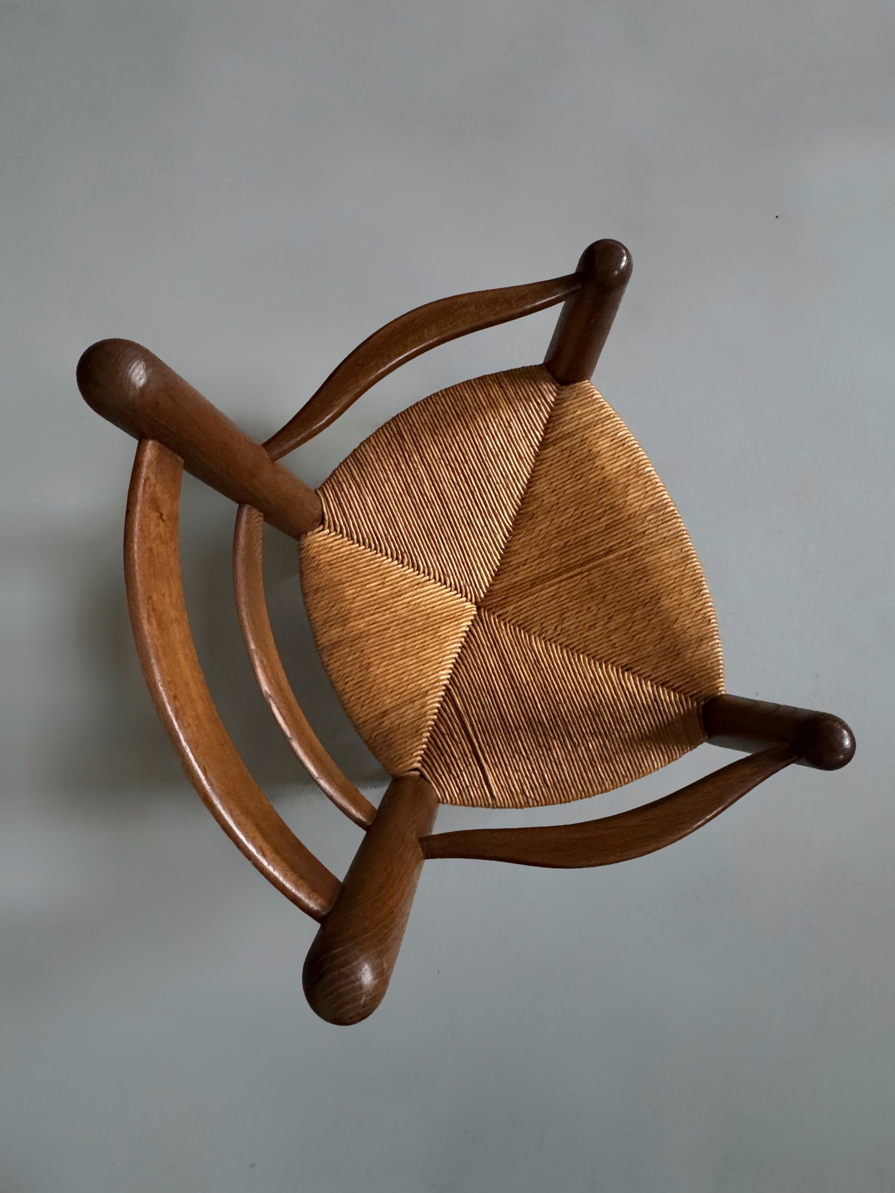 Pair of oak and cane armchairs, France 1950s
