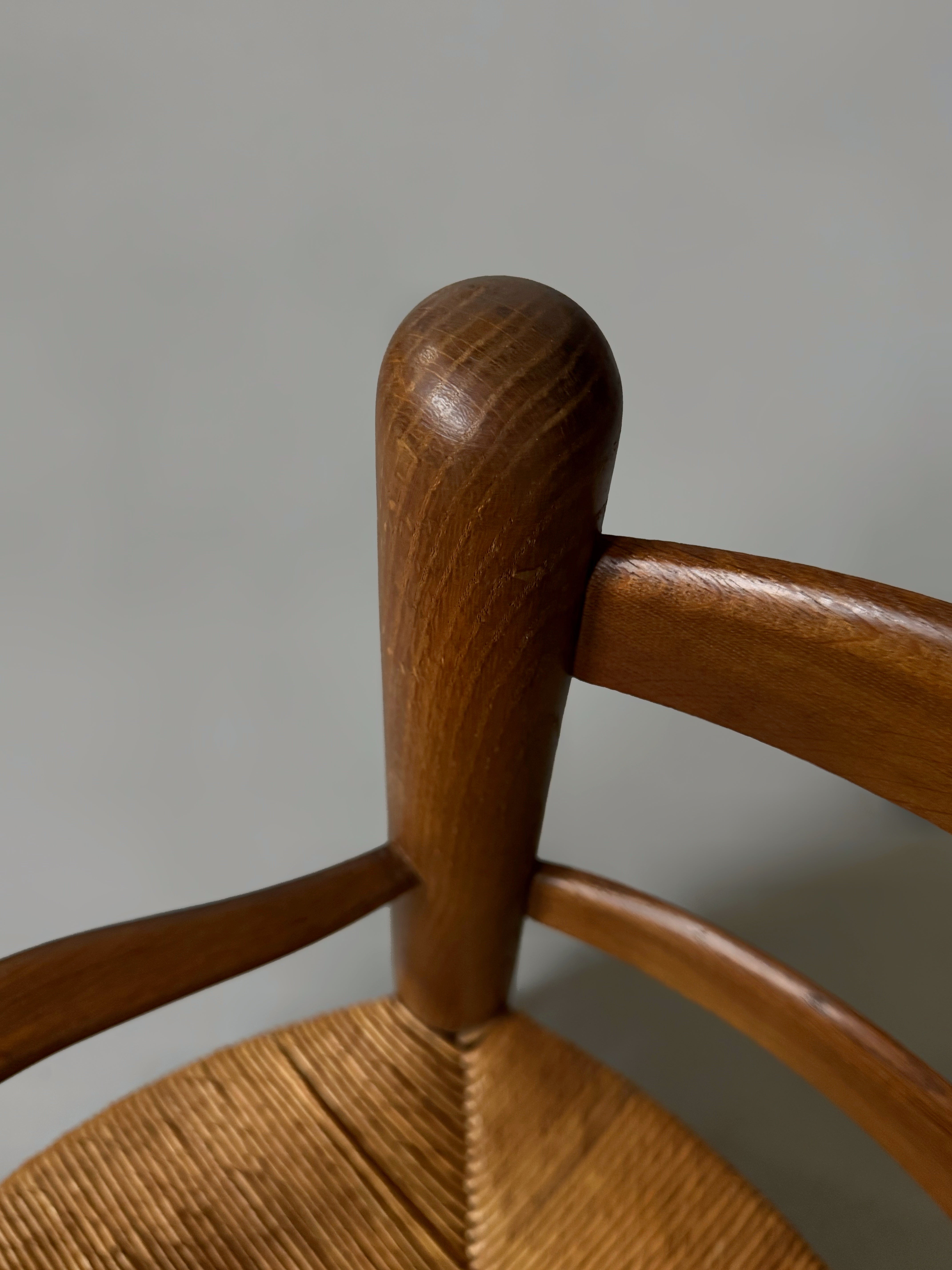 Pair of oak and cane armchairs, France 1950s