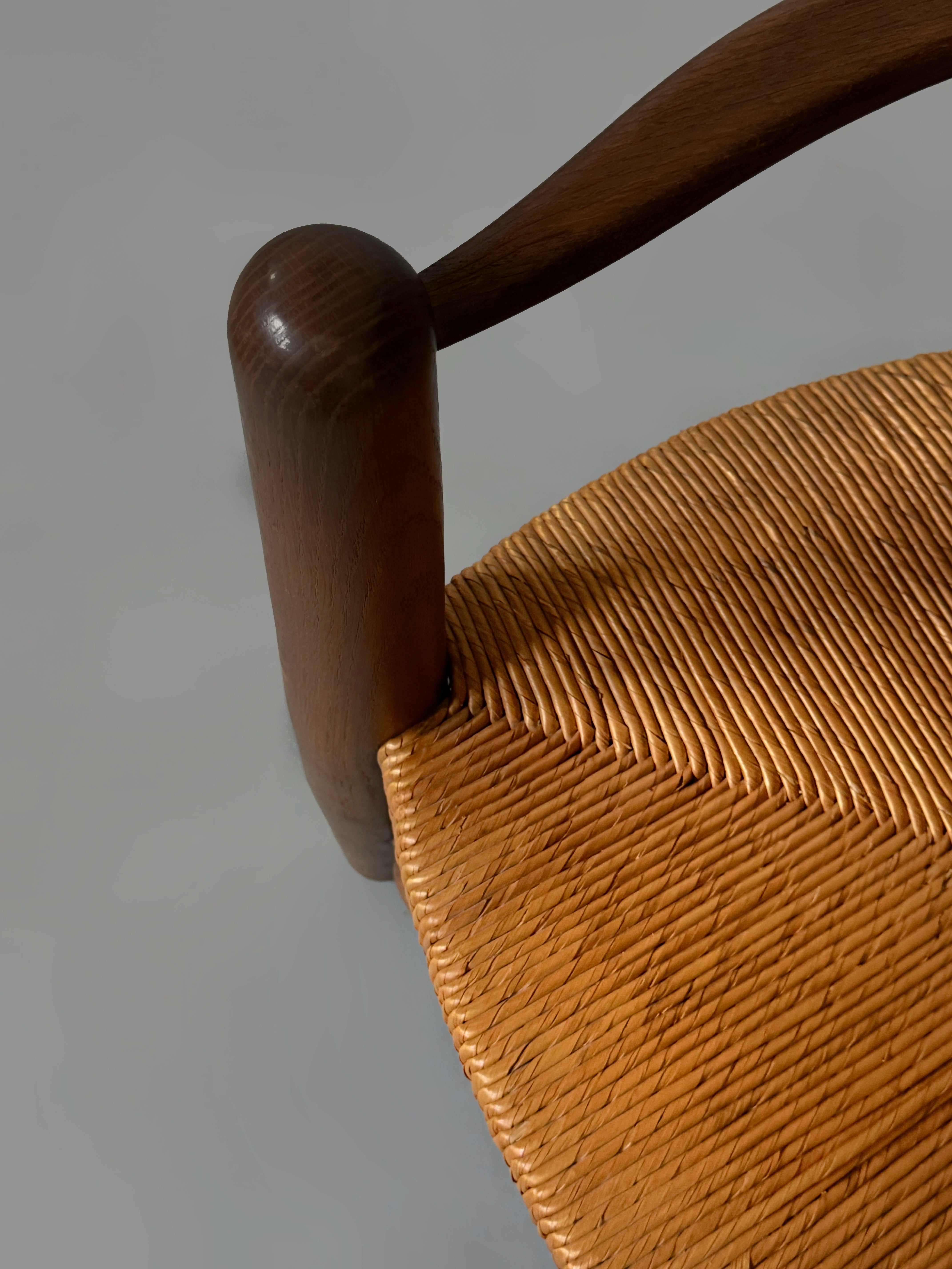 Pair of oak and cane armchairs, France 1950s