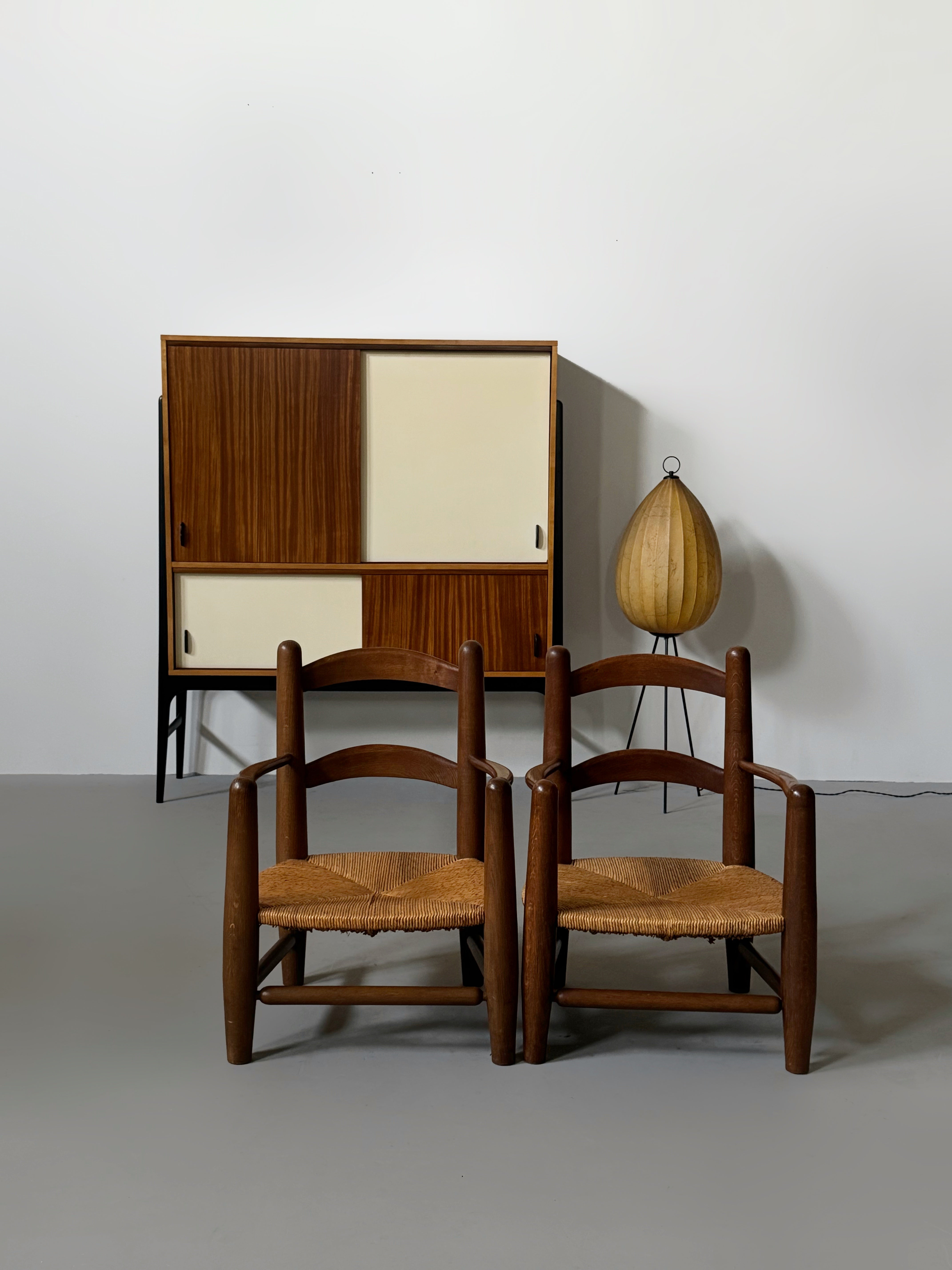 Pair of oak and cane armchairs, France 1950s