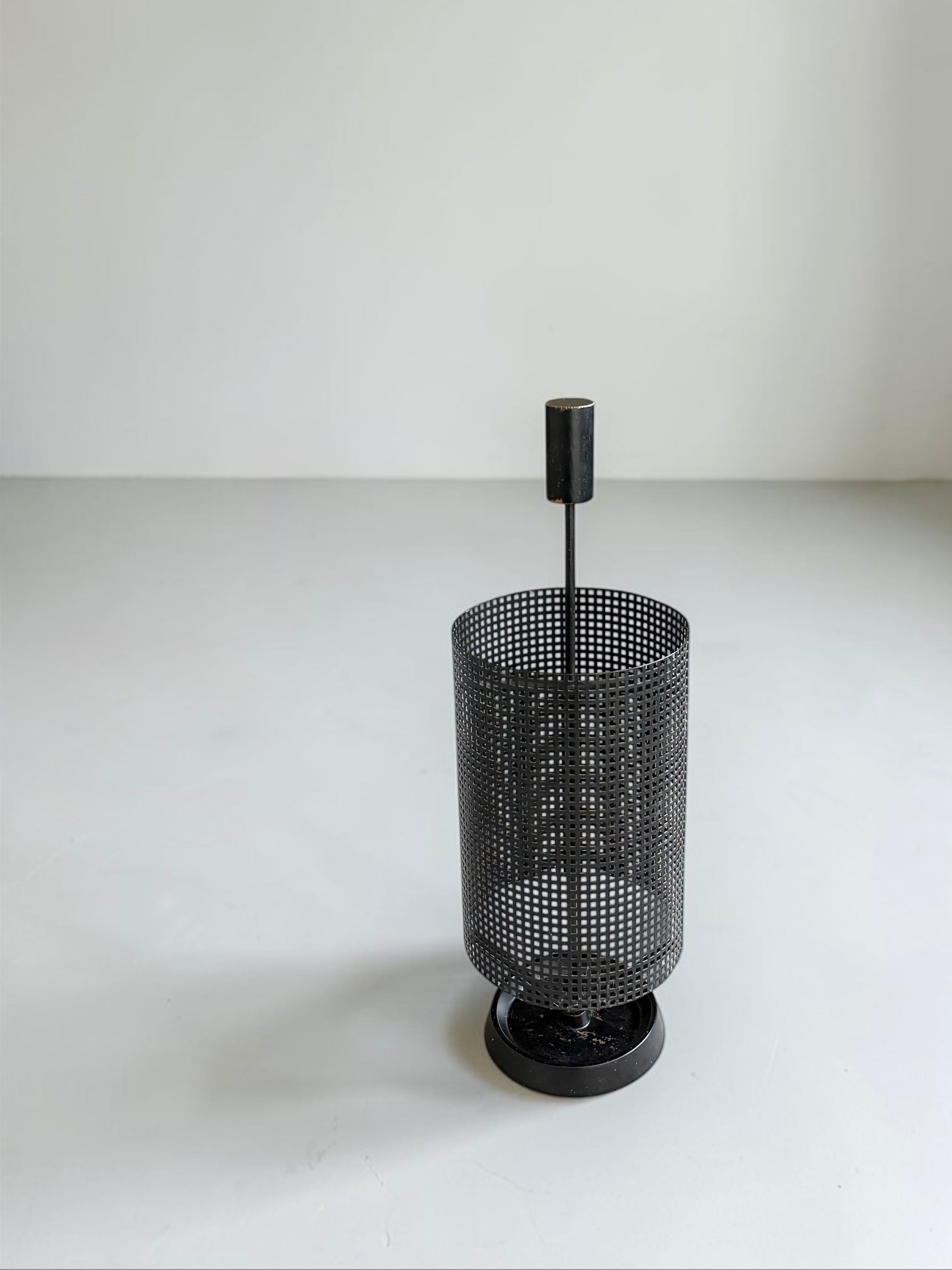 Minimalistic dutch design perforated metal umbrella stand