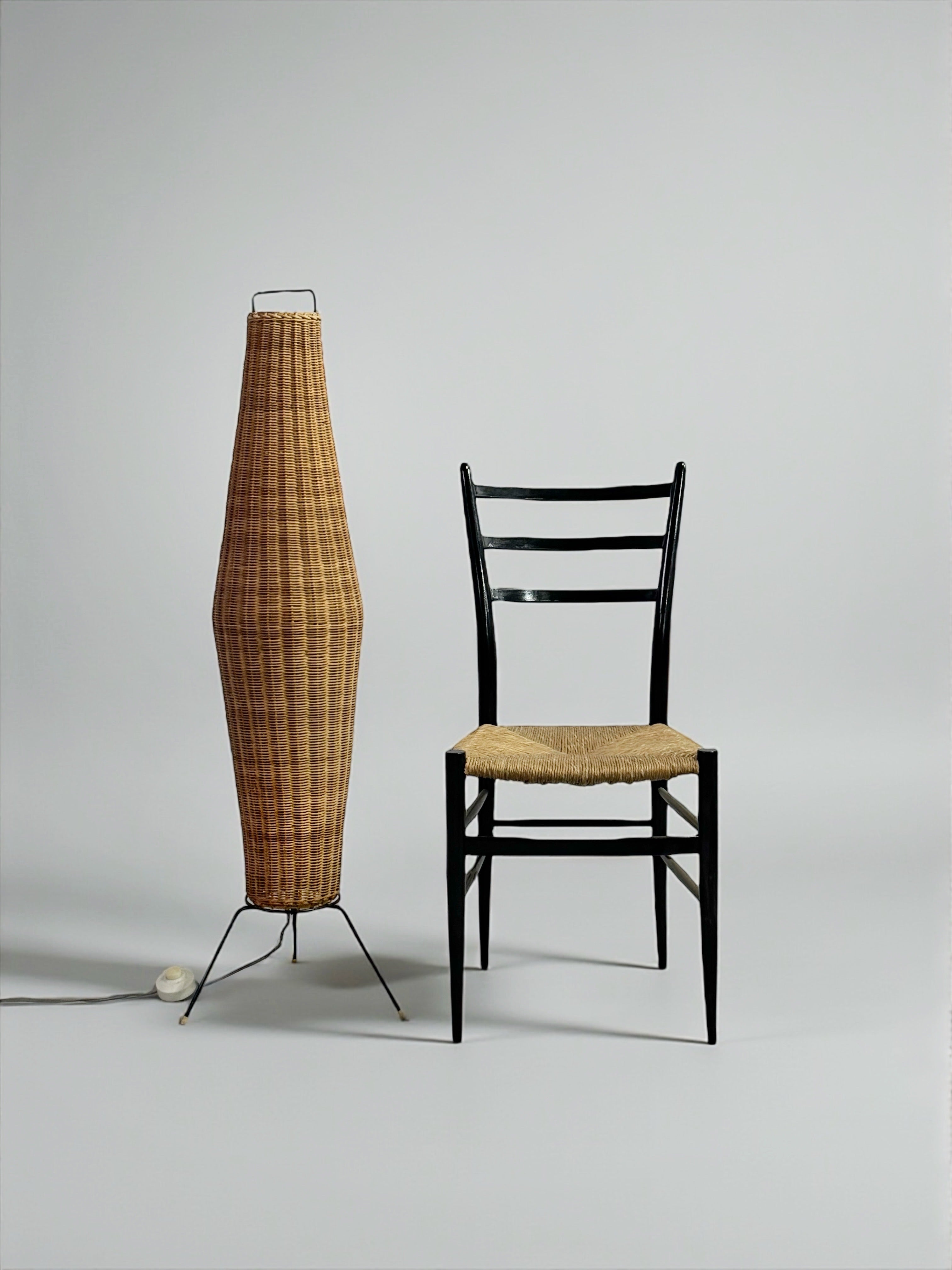 Tripod floor lamp with woven rattan basket, France 1950s