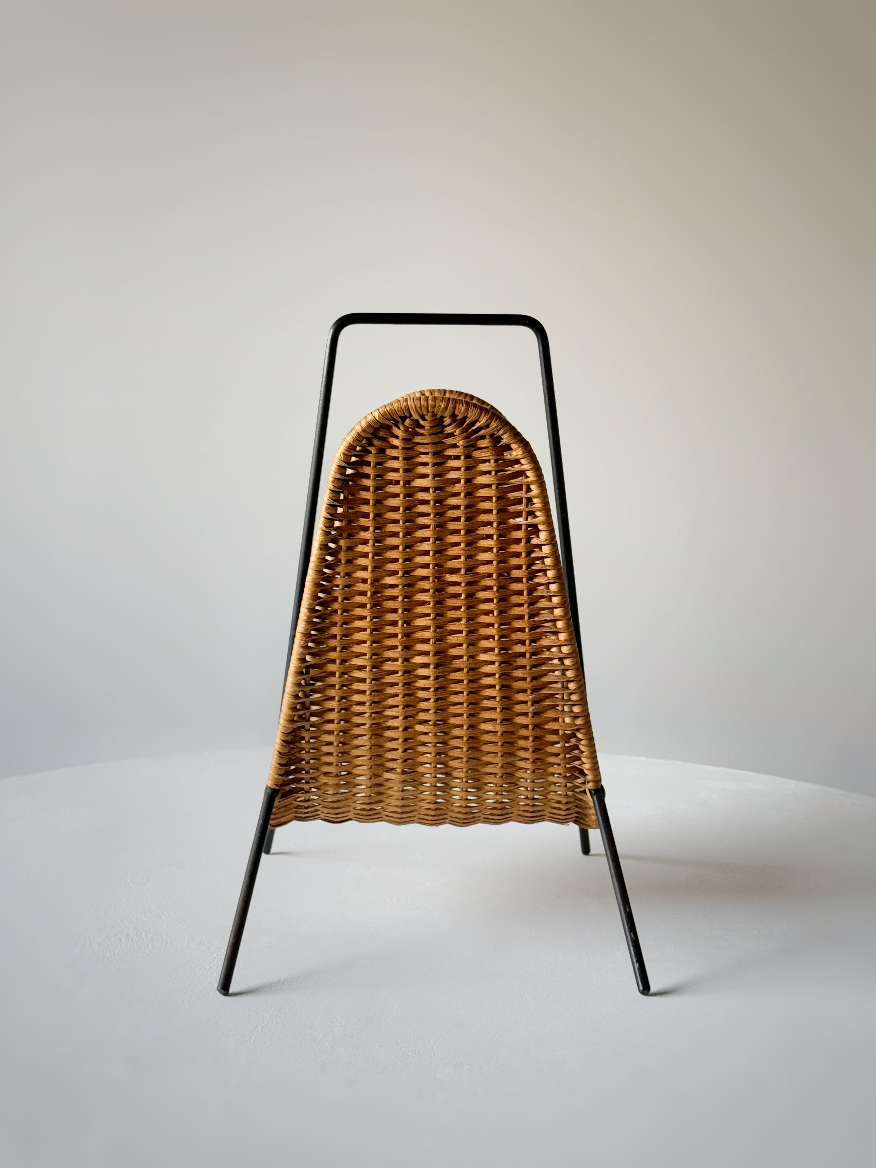 Wicker and metal magazine rack