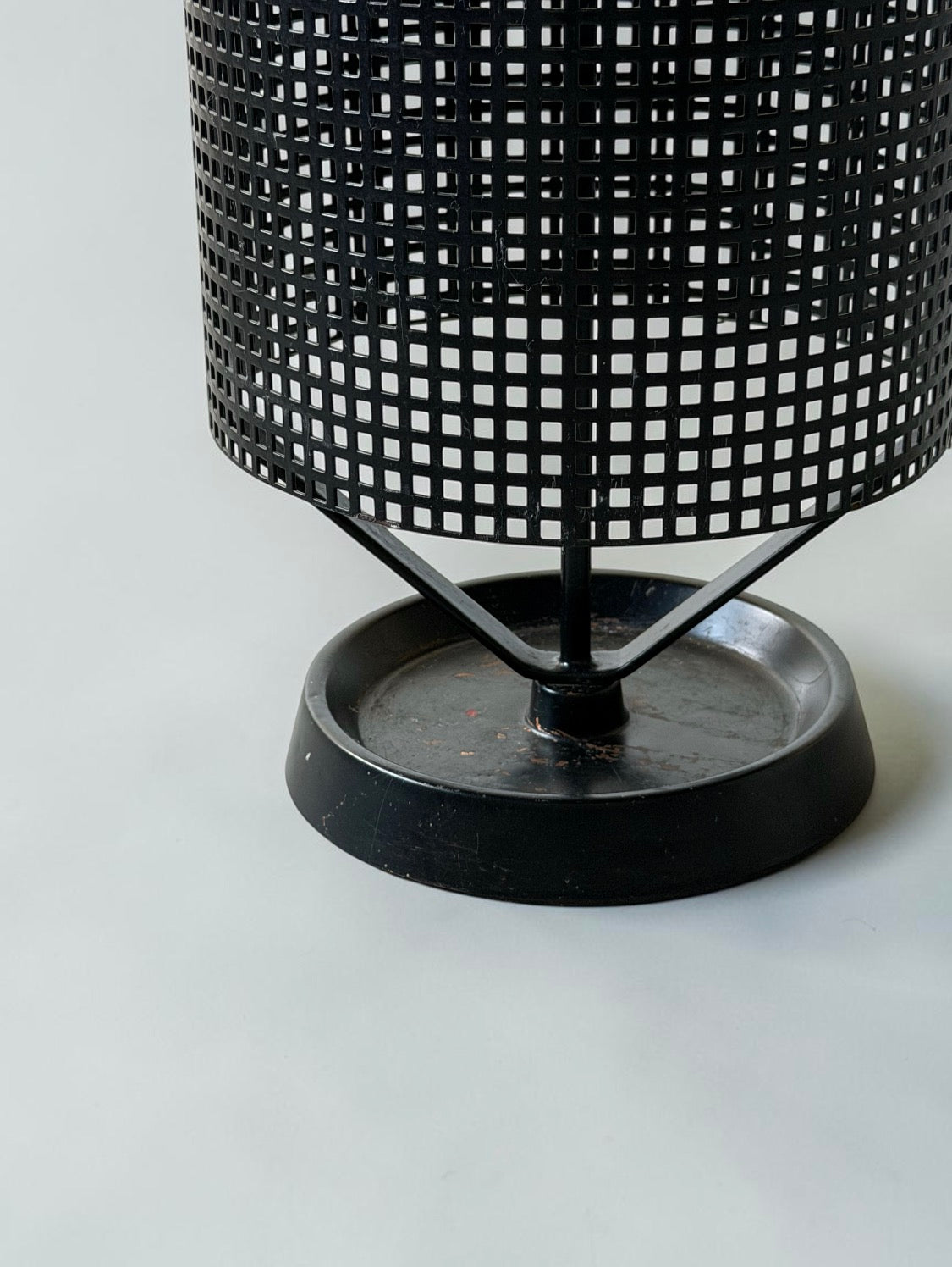 Minimalistic dutch design perforated metal umbrella stand