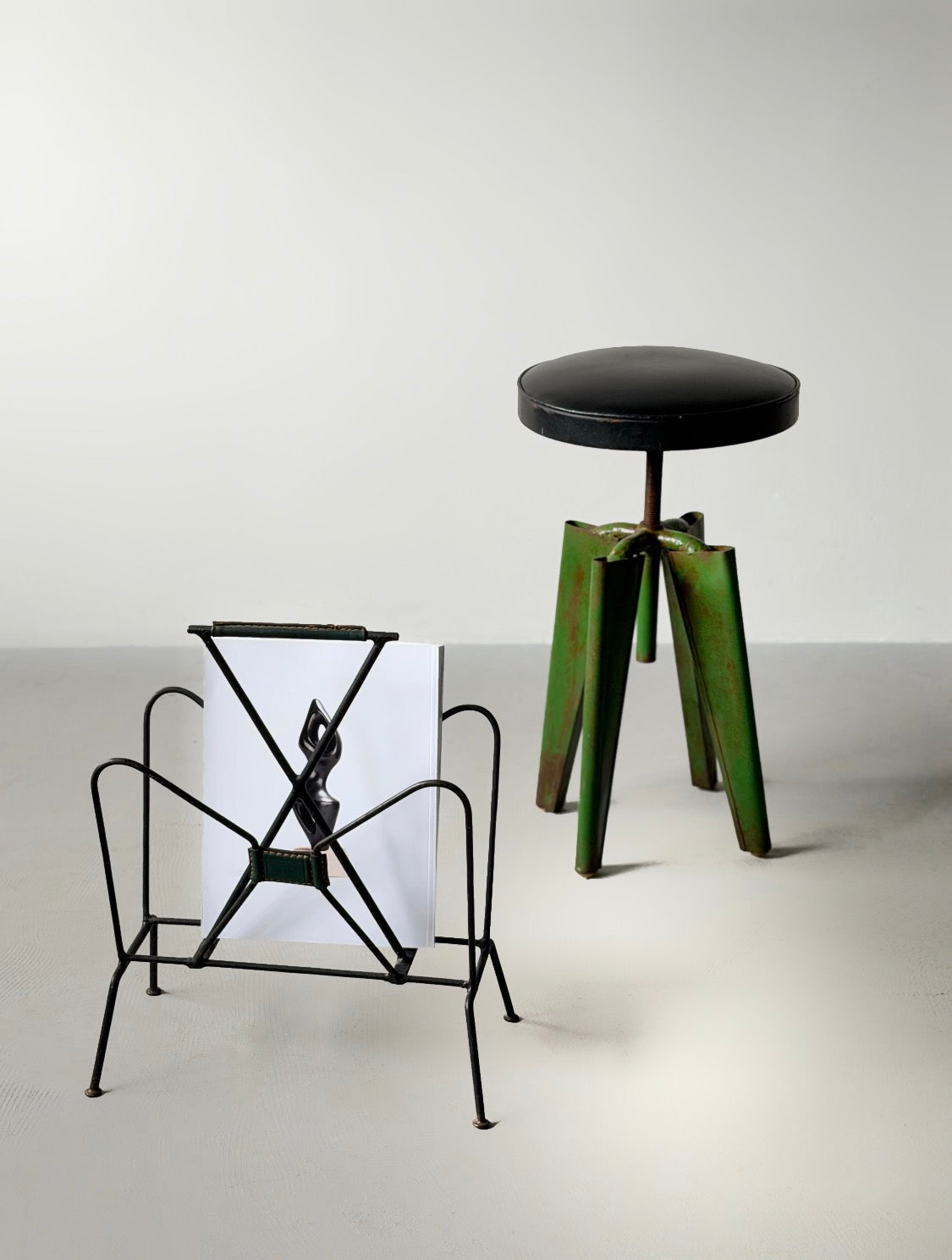 Magazine rack by Jacques Adnet, 1950s