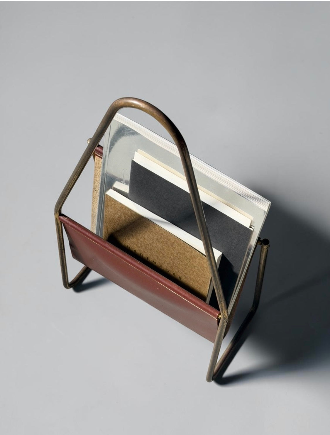 Magazine holder in brass and leather by CARL AUBÖCK (1900-1957) Austria 1950s　