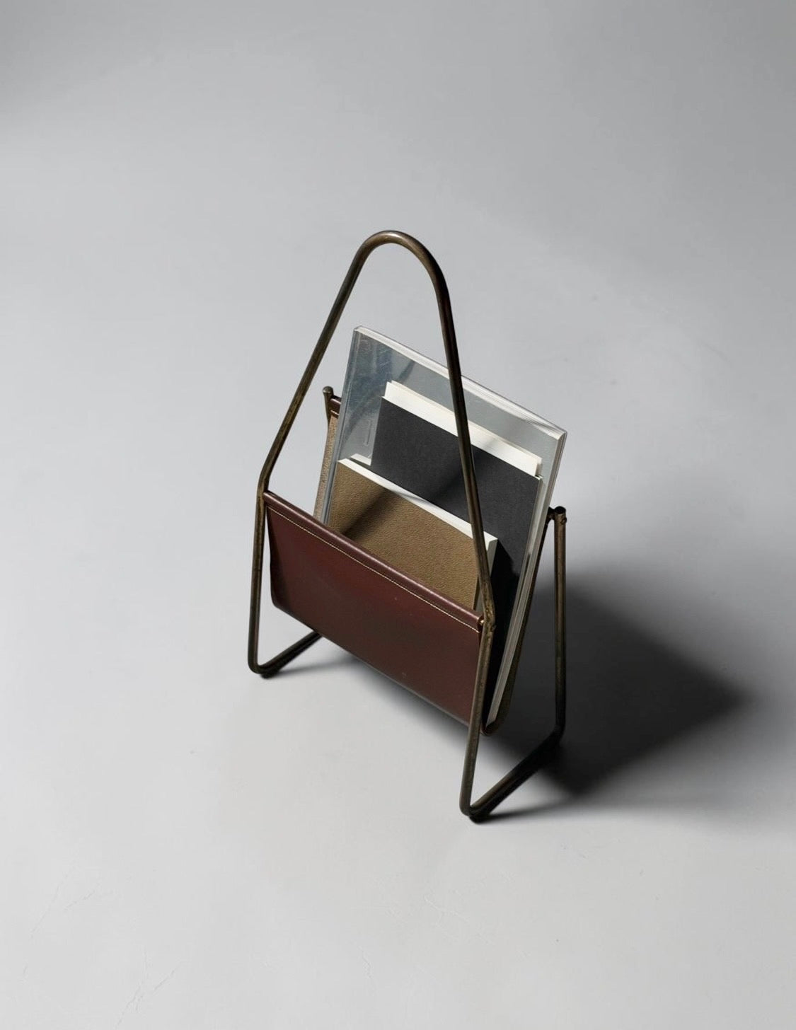 Magazine holder in brass and leather by CARL AUBÖCK (1900-1957) Austria 1950s　